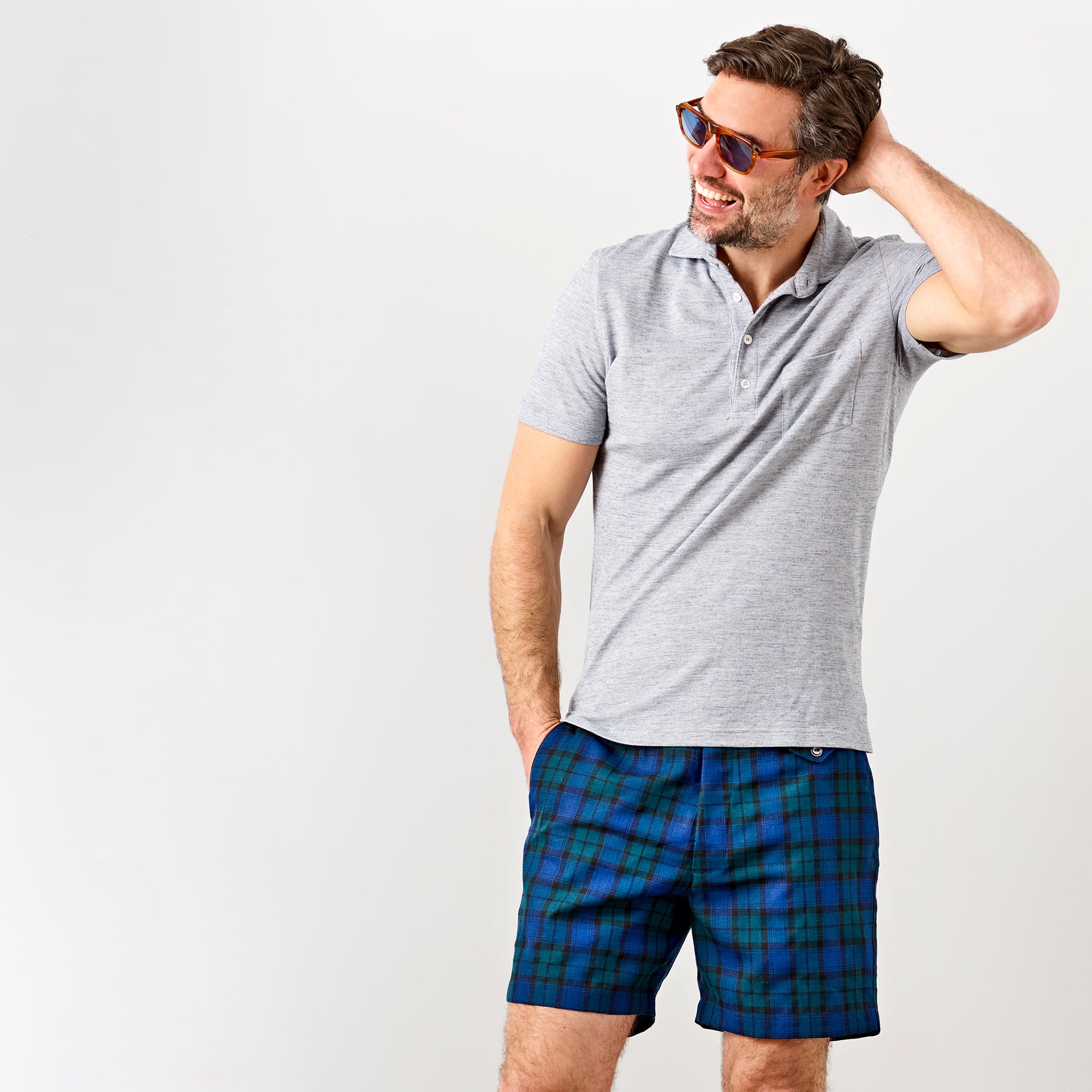 Model shot of a middle aged gentleman, wearing a Fedeli Chest Pocket Polo, in Ringspun Jersey Heather Grey