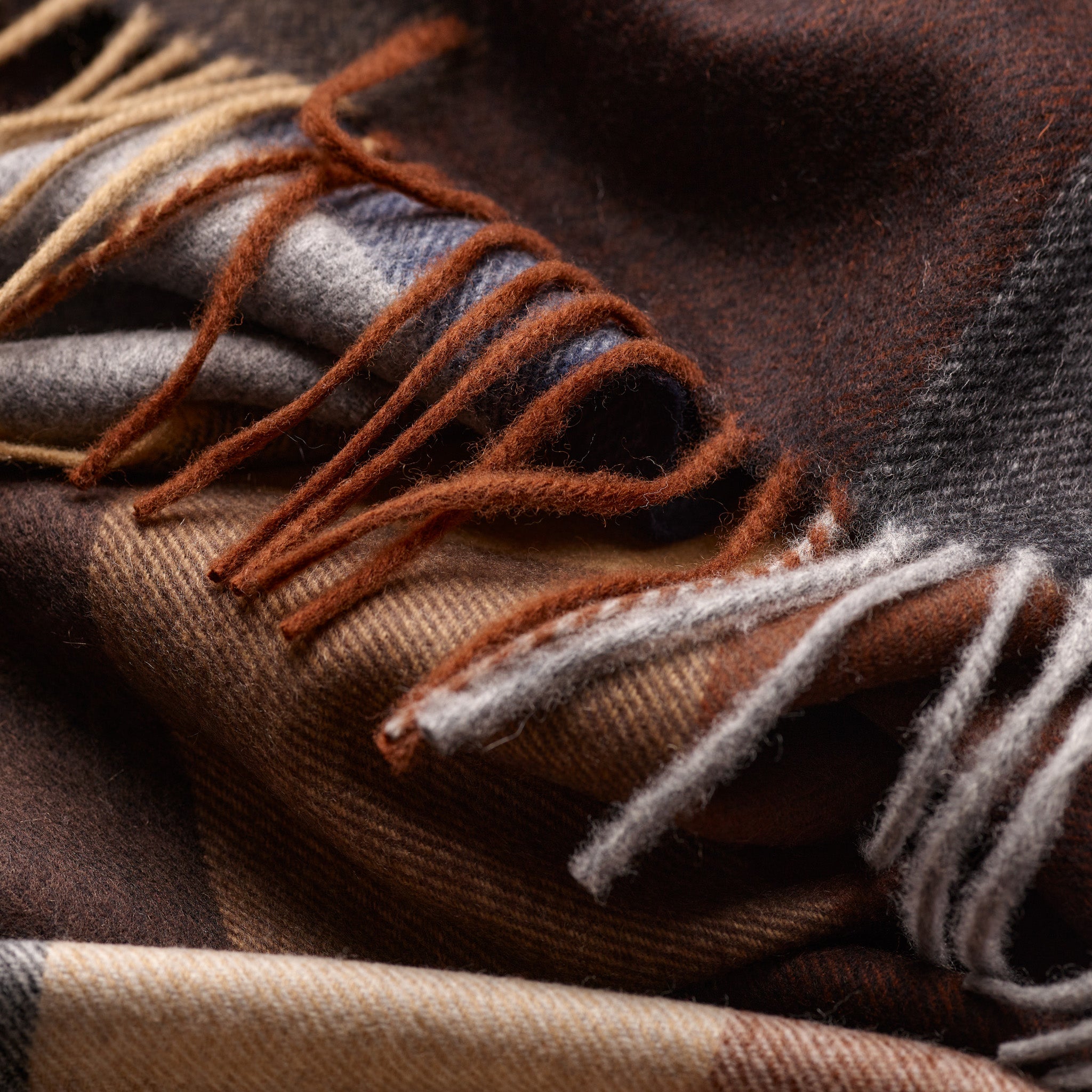 Tasselled hem detail on Fox Brown and Navy Cashmere & Wool Check Scarf